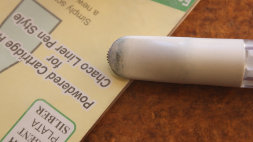 Chaco Liner - showing the little wheel that helps distribute chalk evenly on the quilt top.