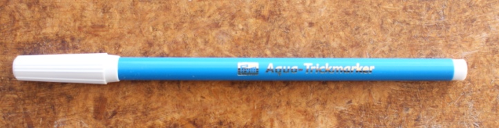 The water soluble pen. Pros - it does leave a clear line; it's sturdy. Cons - it can leave permanent marks; comes in one colour which doesn't show up clearly on all fabrics.