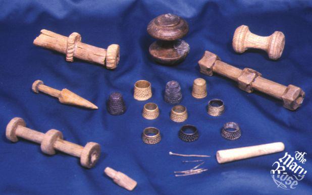 A selection of open-ended thumb thimbles, needle bobbins used by the sailors to keep their kit and ship in good order.