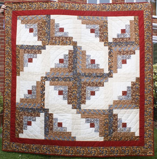 A recent finish. A traditional log cabin with a modern twist - my second attempt at quilting a continuous spiral using a walking foot.