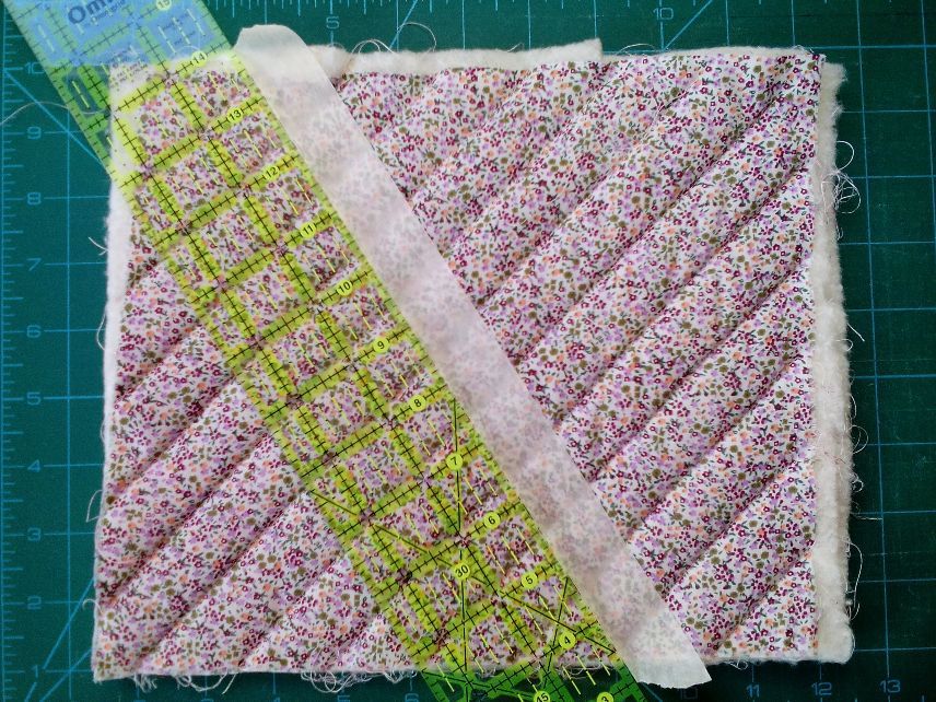 To make the hearts I quilted little 'sandwiches' made of backing and top fabrics with two layers of wadding between. I used masking tape as a guide line for the quilt stitches - quicker than some other methods and no marks to remove after stitching :-)