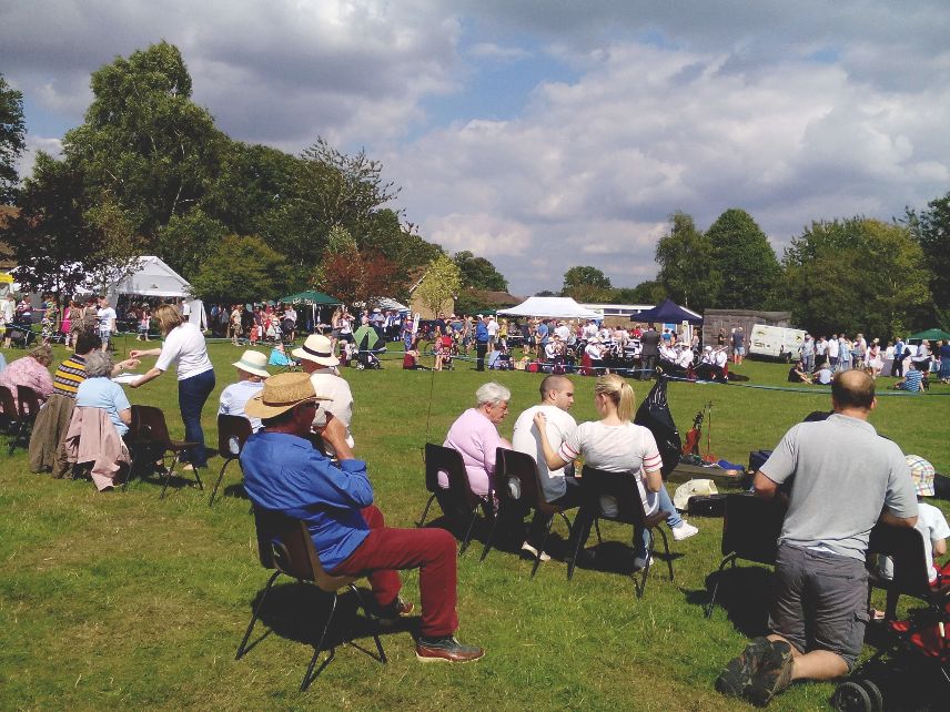 A very English scene - spectators sat round the arena listening to the local Silver Band and awaiting the start of the dog show!