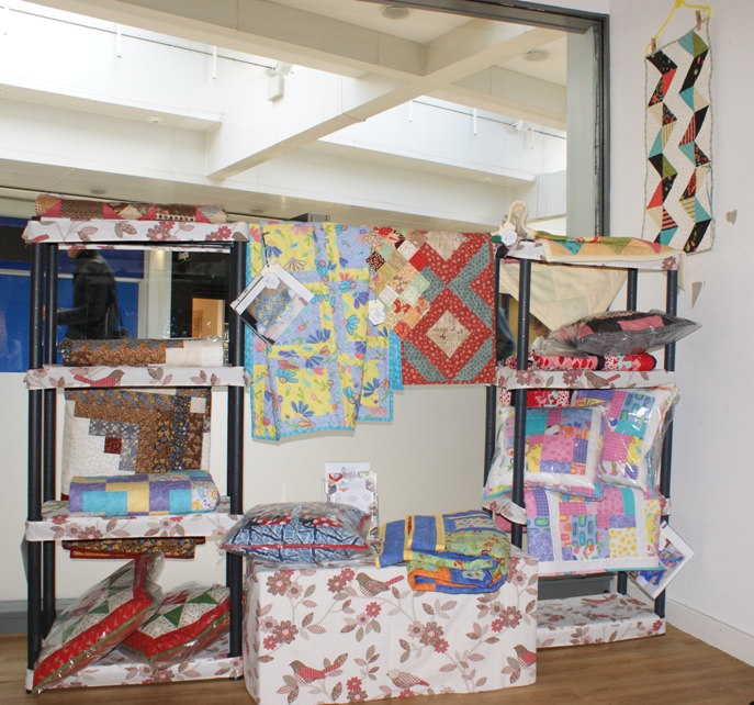 My space in the shop. Note the little chevron quilt mentioned in yesterdays blog post is on the wall but not covering all the spots of peeling paint!