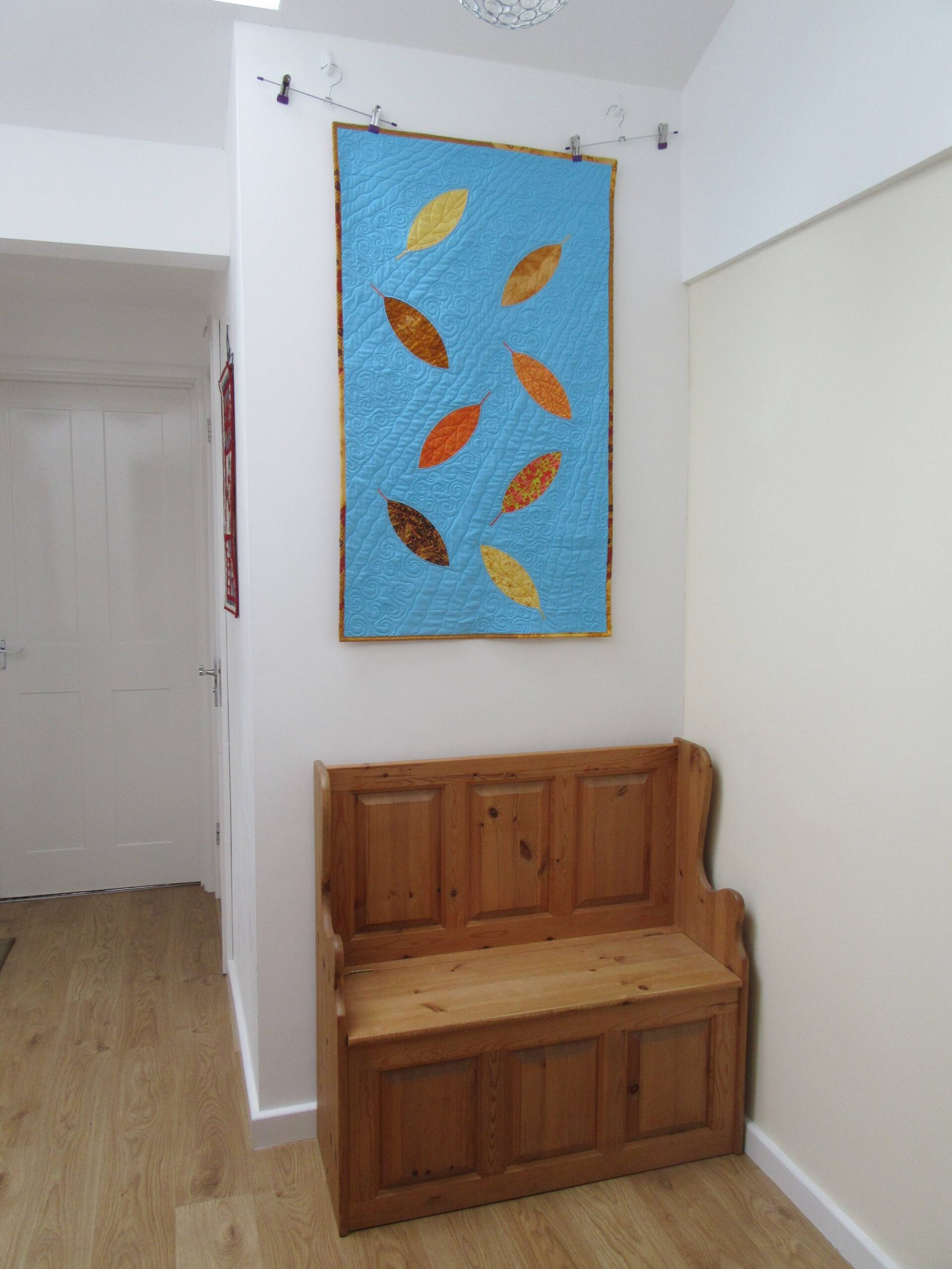 Autumn Leaves hanging in the hall by Allison Reid